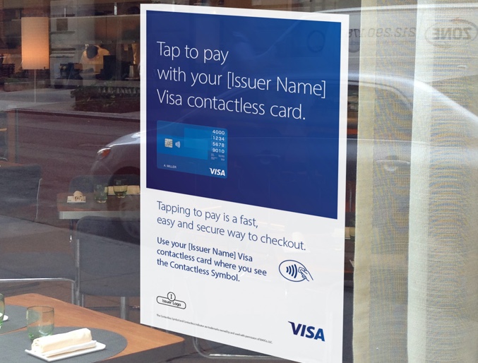 Visa Contactless Card poster displayed on restaurant glass window front