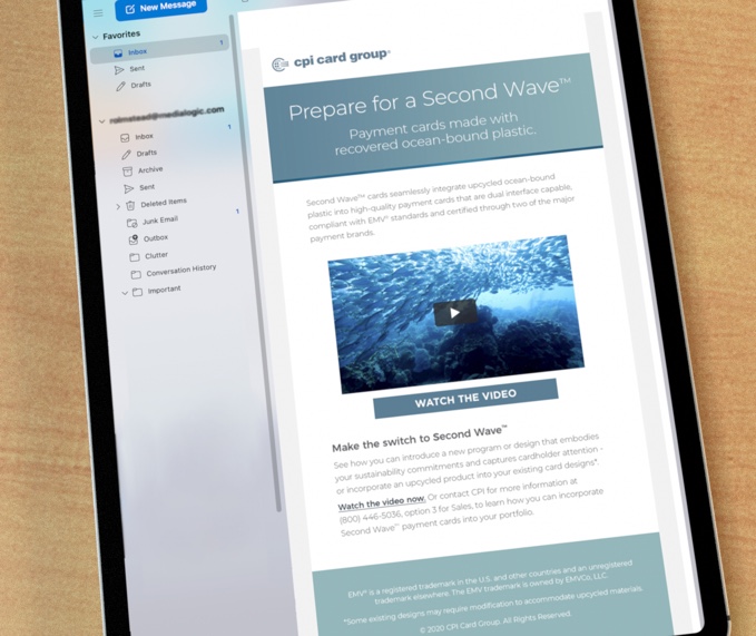 Ipad on wooden tabletop displaying a CPI Second Wave email with video
