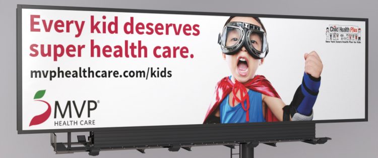 MVP Child Health Plus billboard with young boy dressed as a superhero promoting new child care