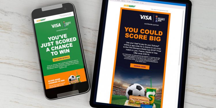 phone and tablet on table showing Visa credit card and sporting event partnership.