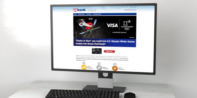 Desktop computer on table showcasing Visa partnership with sports event.