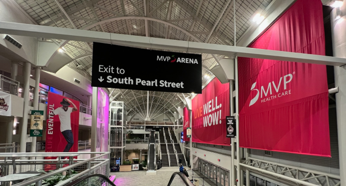 Long inside view of MVP Arena and signage after the rebrand