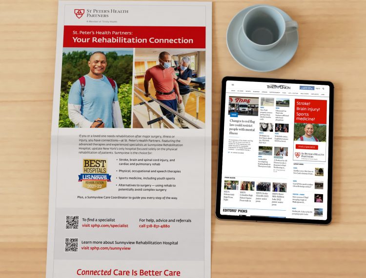 newspaper with ad for connected care across health systems, tablet and coffee cup on table