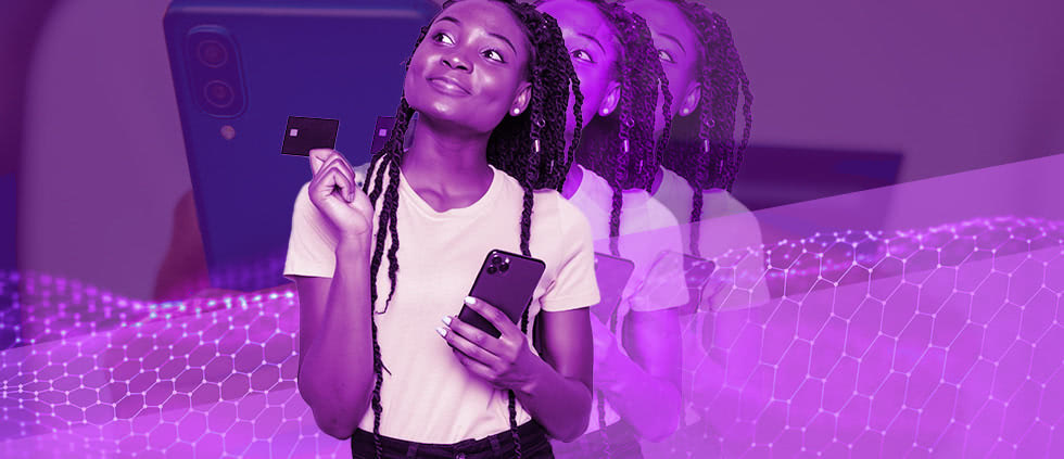 A young woman with braids and a white t-shirt, holding a payment card and a phone and looking contemplative against a purple background