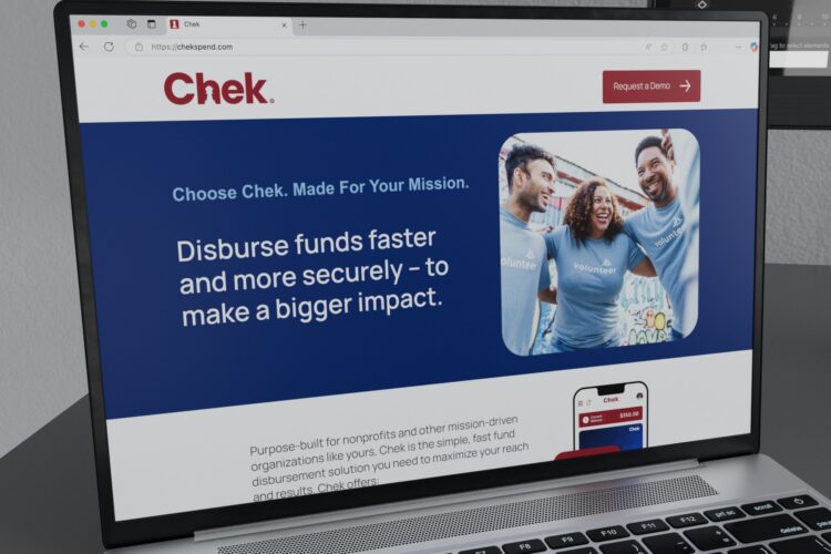 Chek landing page displayed on a macbook